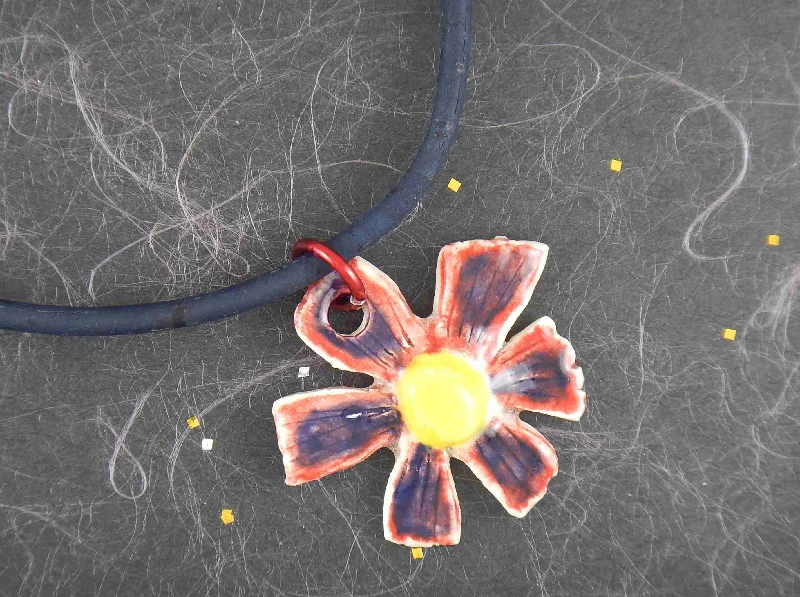 luxury necklaces for women -16-inch necklace with blue-red-yellow ceramic daisy flower pendant handmade in Montreal, dark blue cork cord, aluminum ring, stainless steel clasp