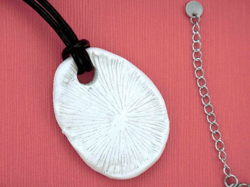 fine jewelry necklaces for women -22-inch necklace with off-white ceramic coral pendant handmade in Montreal, black leather cord, stainless steel clasp