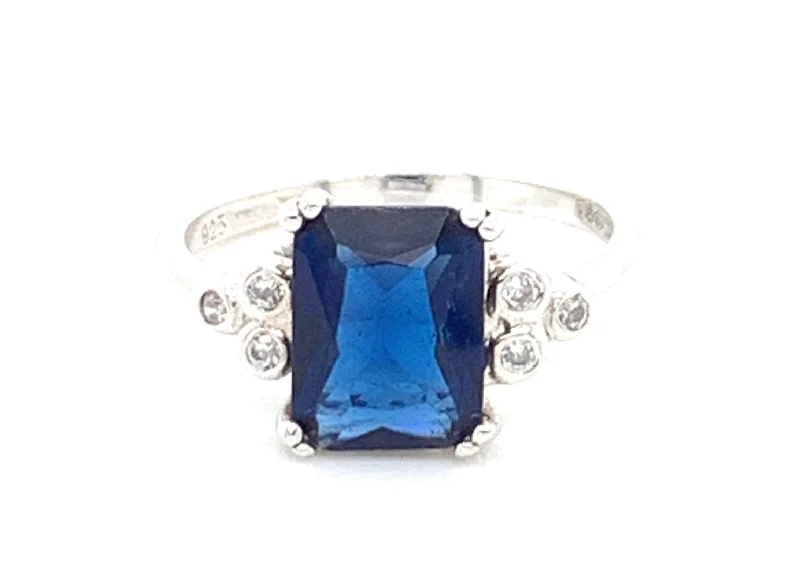 halo engagement rings -Sterling Silver Sapphire And Cz Emerald Cut Ring With A trio of Side Stones